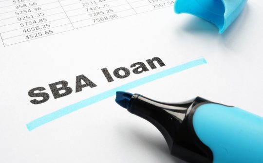 SBA loan underlined words and marker.